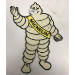 A modern painted cast metal sign "Michelin Man"