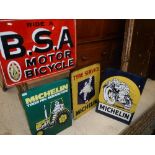 A collection of four reproduction metal signs including "Ride a B.S.A.