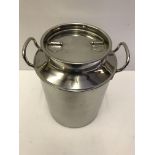 A modern miniature stainless steel milk churn