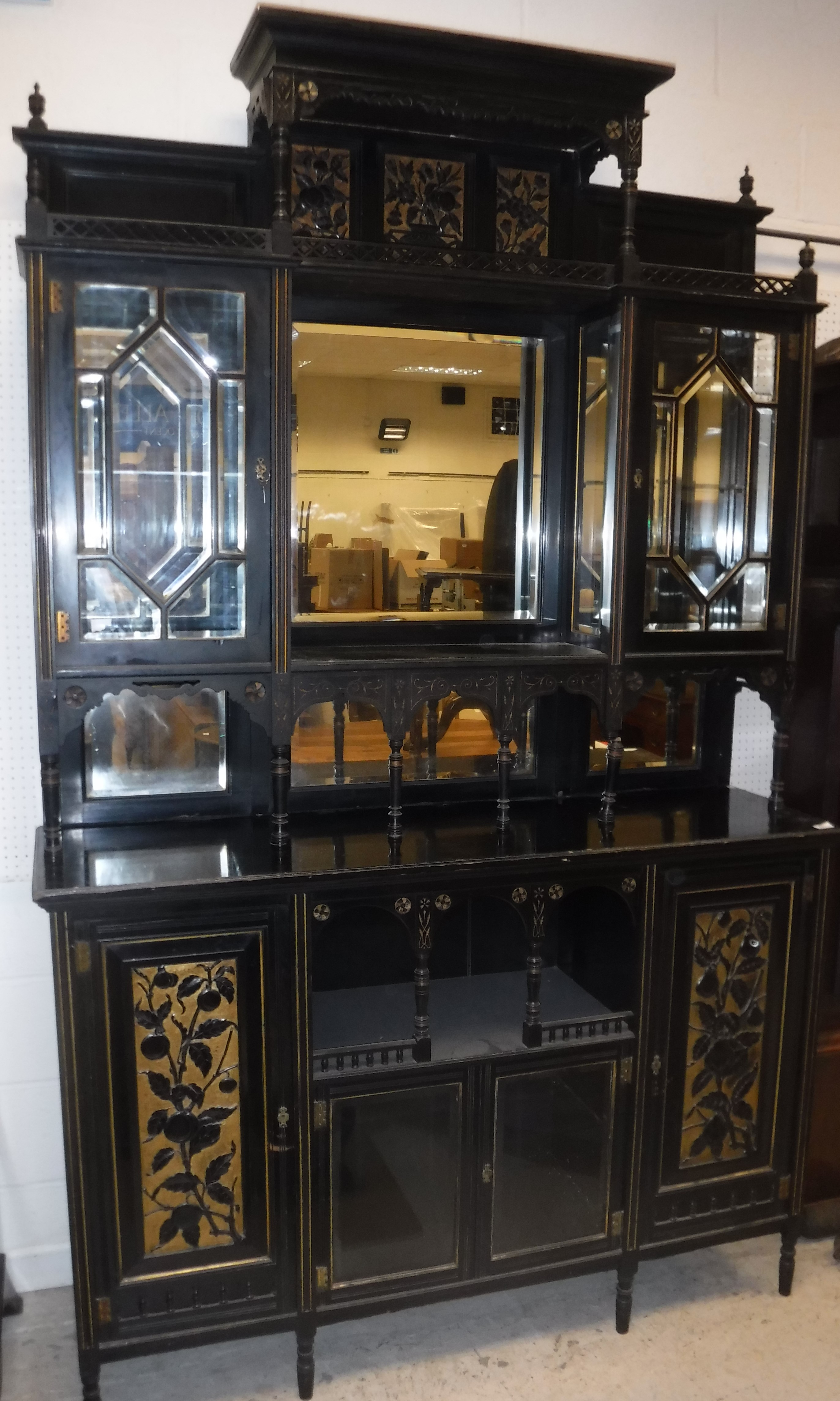 A Victorian Aesthetic period black or ebonised mirrored back sideboard with gilt decoration,