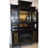 A Victorian Aesthetic period black or ebonised mirrored back sideboard with gilt decoration,
