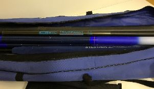 A blue canvas rod bag and contents of various rod sections, rods, tubes,