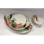A CreArt hand-painted seafood serving set comprising four bowls, four dinner plates,
