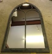 A modern leaded effect Gothic style garden mirror,