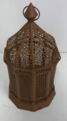 A pierced metal Moroccan style lantern,