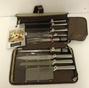 A Waltmann und Sohn 9 piece knife set in case