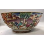 A Qianlong polychrome decorated famille rose bowl with all over decoration of figures in garden