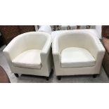 A near matching pair of modern Italian cream leather upholstered tub chairs on square tapered
