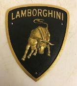 A modern painted cast metal sign "Lamborghini",