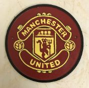 A modern painted cast metal sign "Manchester City",