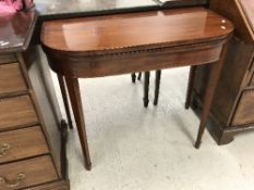 A 19th Century mahogany fold-over card table on square tapered legs to spade feet, 90 cm wide x 74.