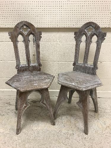 A pair of limed oak hall chairs in the Gothic Revival taste,
