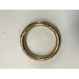 An unmarked gold bangle, the inside inscribed "Mabel M H Adcock, 15 Embassy Court,