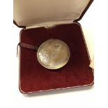 A Turks and Caicos silver medallion with certificate dated 1st June 1971 and No'd.
