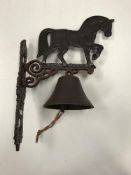 A painted cast metal "Heavy Horse" bell 29 x 41 cm