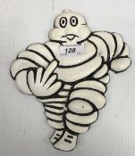 A modern painted cast metal sign "Michelin Man - flipping the bird" 22 cm high