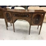 An Edwardian mahogany and inlaid serpentine fronted sideboard,