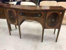 An Edwardian mahogany and inlaid serpentine fronted sideboard,