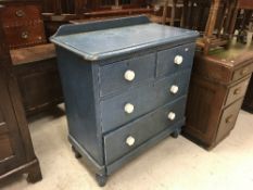A Victorian petrol blue painted pine chest of two short over three long graduated drawers on turned