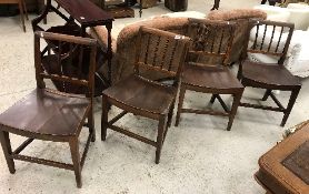 A set of four 19th Century Norfolk fruitwood slat-back dining chairs with shaped seats on square