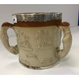 A Victorian Lambeth style stoneware harvest tyg with silver mounts,