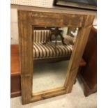 A rustic pine rectangular framed wall mirror with plain plate,