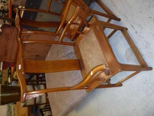 A pair of 20th Century Chinese elm elbow chairs with rattan seats on turned legs united by - Image 2 of 16