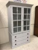 A modern painted cabinet on chest, the glazed top,