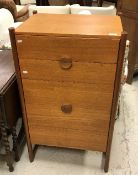 A mid 20th Century teak chest of four drawers, 60 cm wide by 103 cm high,