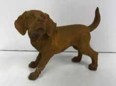 A modern cast iron Puppy with rust effect finish,