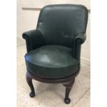 A green leatherette upholstered swivel office chair in the Georgian style,