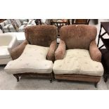 A pair of modern brown velour upholstered deep armchairs in the manner of Howard of London raised