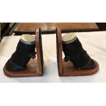 A pair of Water Buffalo hoof bookends with plated mounts, on hardwood bases,