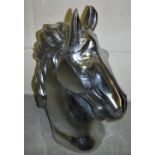 A polished aluminium horse head ornament 45cm high