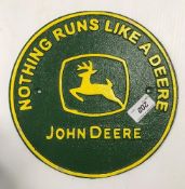 A painted cast metal sign "Nothing Runs a Deere - John Deere" 24 cm