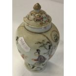 An early 19th Century Chinese vase of ovoid form decorated with panels of two women and child,