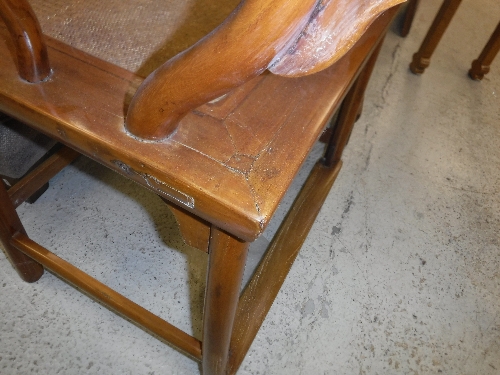 A pair of 20th Century Chinese elm elbow chairs with rattan seats on turned legs united by - Image 7 of 16