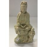 A Chinese blanc de chine figure of Guan Yin with attendant,