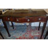 An Edwardian mahogany serpentine fronted side table,