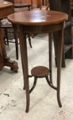 An Edwardian mahogany and inlaid two-tier plant stand, a mahogany scroll arm salon chair,