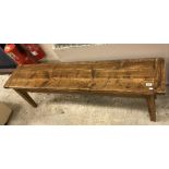 A waxed and stained pine bench seat in the French taste,