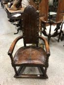 A circa 1900 studded leather and embossed decorated elbow chair on wrythen carved supports united
