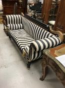 A Victorian ebonised and gilt decorated scroll arm sofa in the Empire taste,