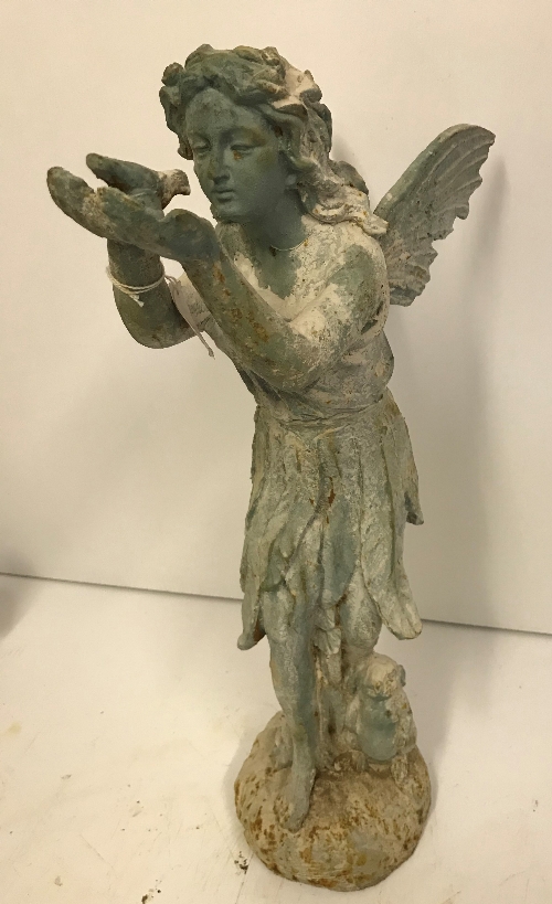 A modern cast metal figure of a Fairy with dove in hand with verdigris and rust effect patination,