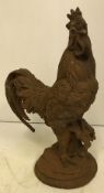 A modern cast metal Cockerel with rust effect patination,