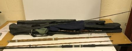 Two rod bags containing various rods and rod sections