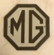 A modern painted cast metal sign "MG", 23.