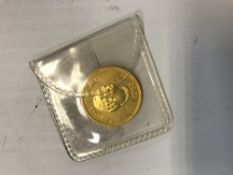 A 1962 gold quarter koula
