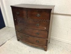 A late 19th Century mahogany bow fronted chest of two short over three long graduated drawers on