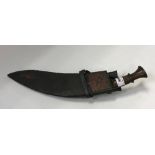 A Gurkha kukri in leather scabbard, together with nine various skinning knives and other implements,
